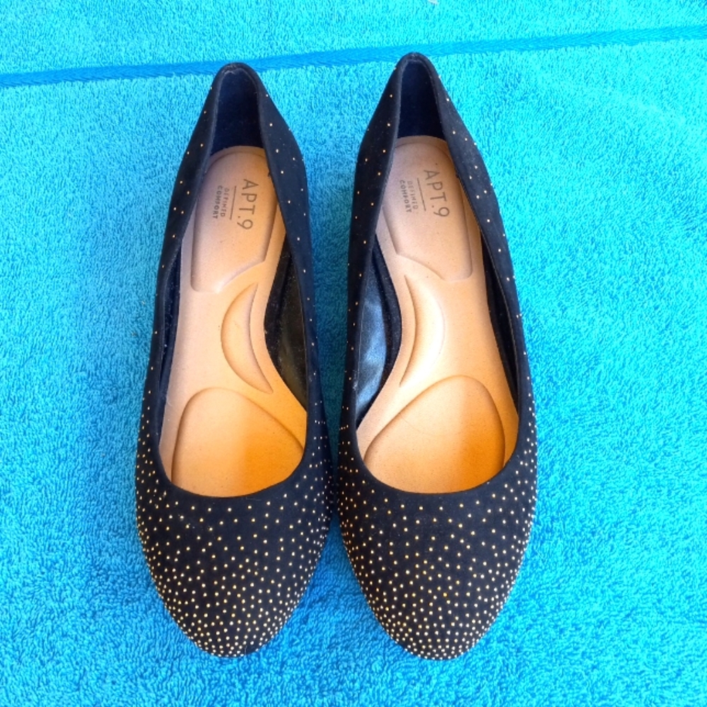 Like new. Black with gold specs and heels